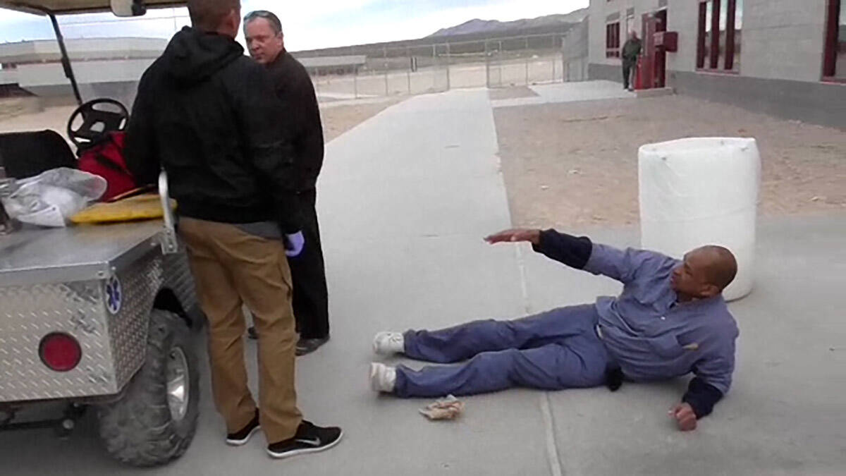 A screenshot from a video shown during the trial depicts inmate Reginal Howard fallen down on a ...