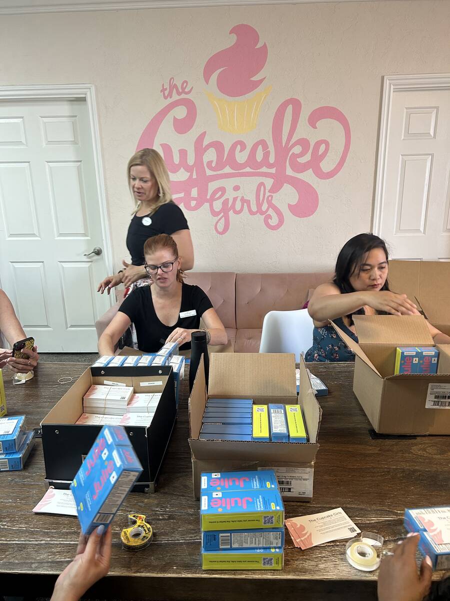 The Cupcake Girls volunteers put together hygiene kits to distribute in the community. (Courtes ...