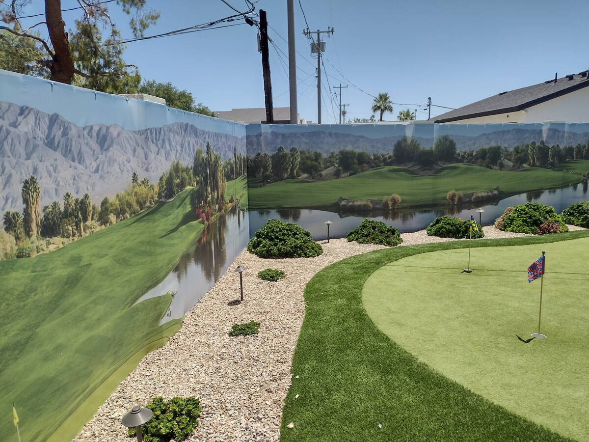 A putting green appears to be part of a larger golf course, part of the mural installed on the ...