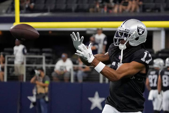 Las Vegas Raiders wide receiver Davante Adams warms up before a preseason NFL football game aga ...