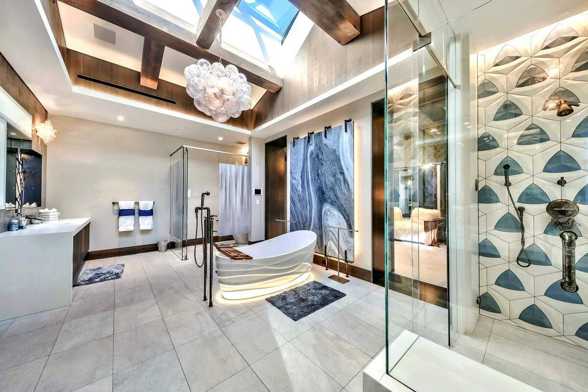 In addition to a large master bath, the home has other wellness amenities such as a salt room, ...