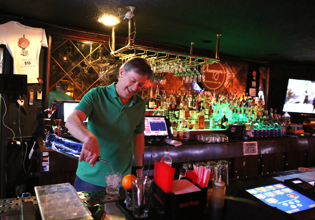 Greg Sims, owner of Champagnes Cafe, pours drinks on Wednesday, April 25, 2018, in Las Vegas. ( ...