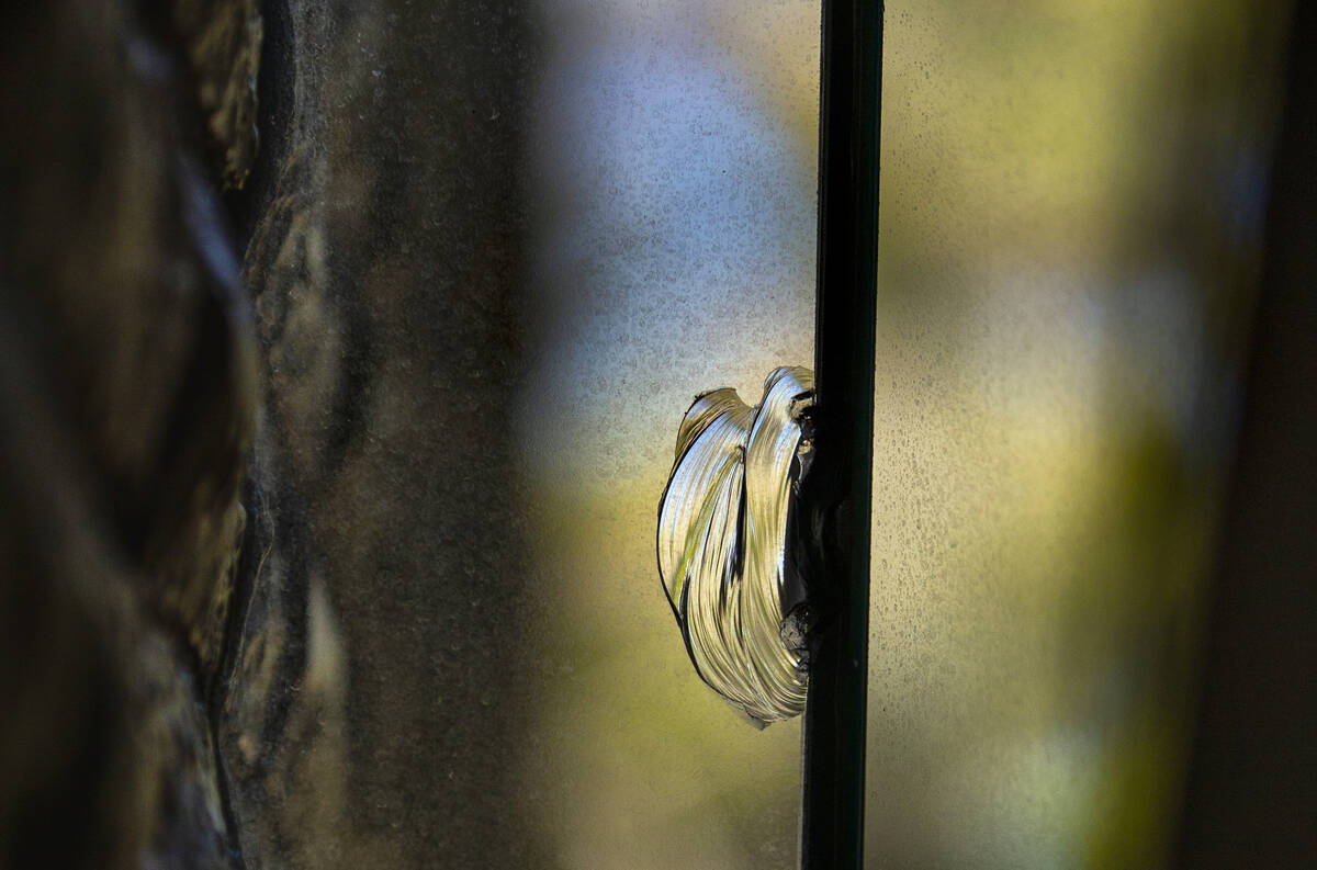 A chip in a window believed to have been caused by bullet at Lefty Rosenthal's former home on M ...