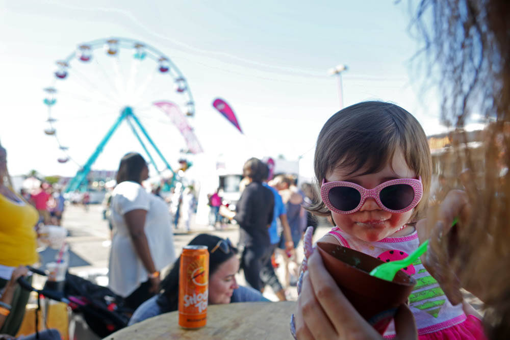 Lyric, 1, eats a dirt cup from the vendor, Ice Cream Garden LA, at the Great American Foodie Fe ...
