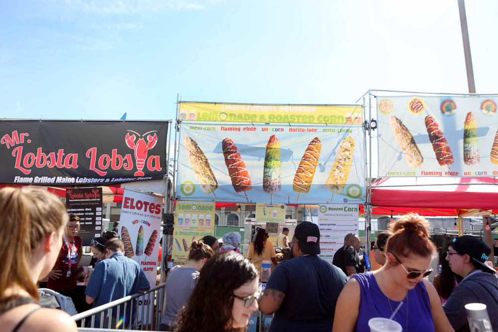 Visitors of the Great American Foodie Fest wonder around different food vendors at the festival ...