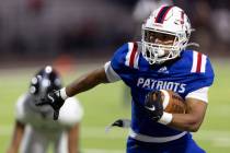 Liberty’s Isaiah Lauofo (3) runs the ball during a Class 5A high school football game ag ...