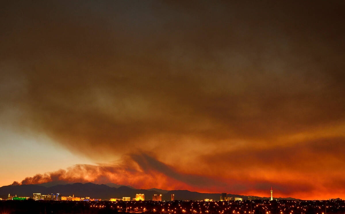 Smoke from the Carpenter 1 Fire rises over the Strip in Las Vegas on Tuesday, July 9, 2013. (La ...