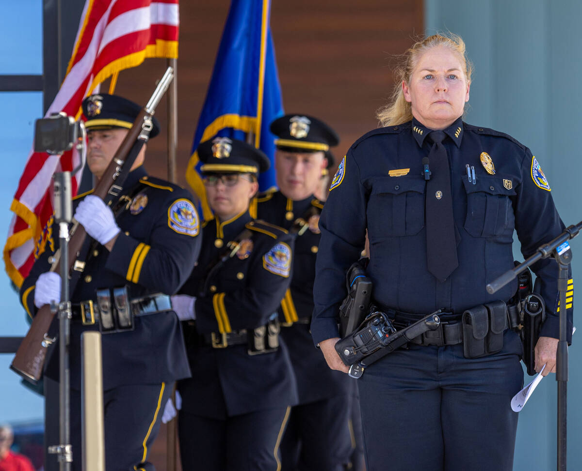 Henderson Police Chief Hollie Chadwick stands at attention as the colors are presented during t ...