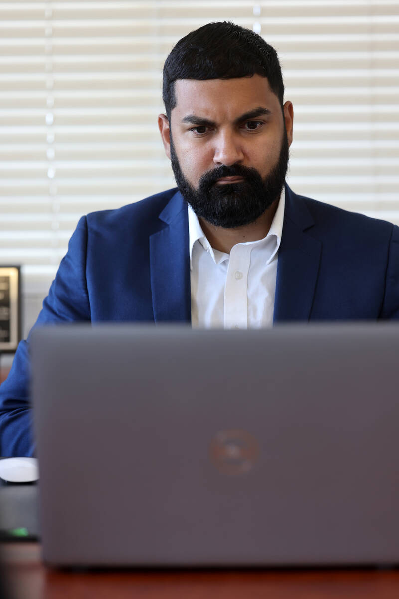 American Civil Liberties Union of Nevada Executive Director Athar Haseebullah reacts while watc ...