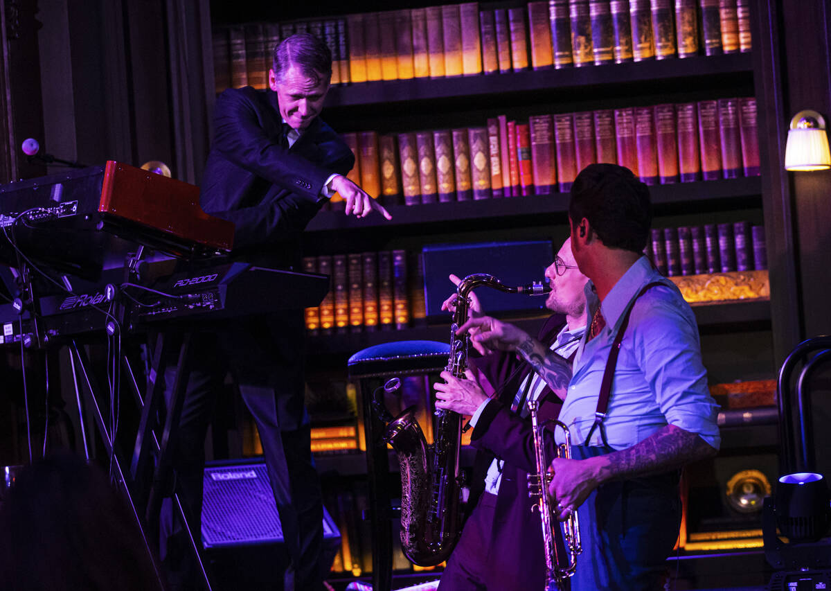 Alex Smith performs on keys, left, in Brian Newman’s "After Dark" show at NoMa ...