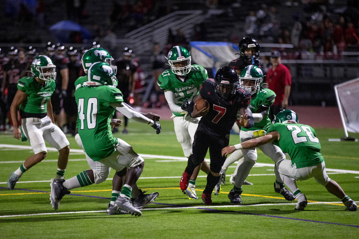 Las Vegas running back Torrell Harley (7) carries the ball while Rancho closes in on him during ...