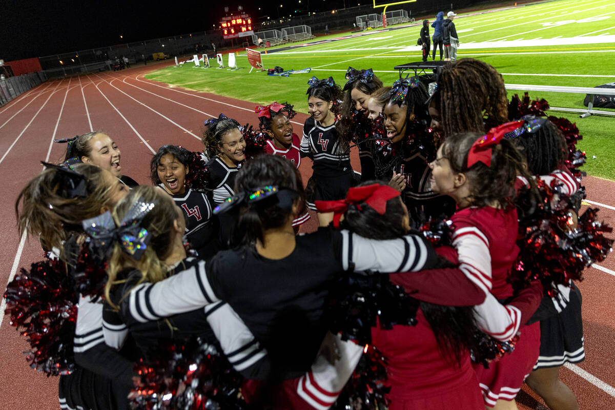 Las Vegas cheerleaders celebrate their win in a high school football game against Rancho at Las ...