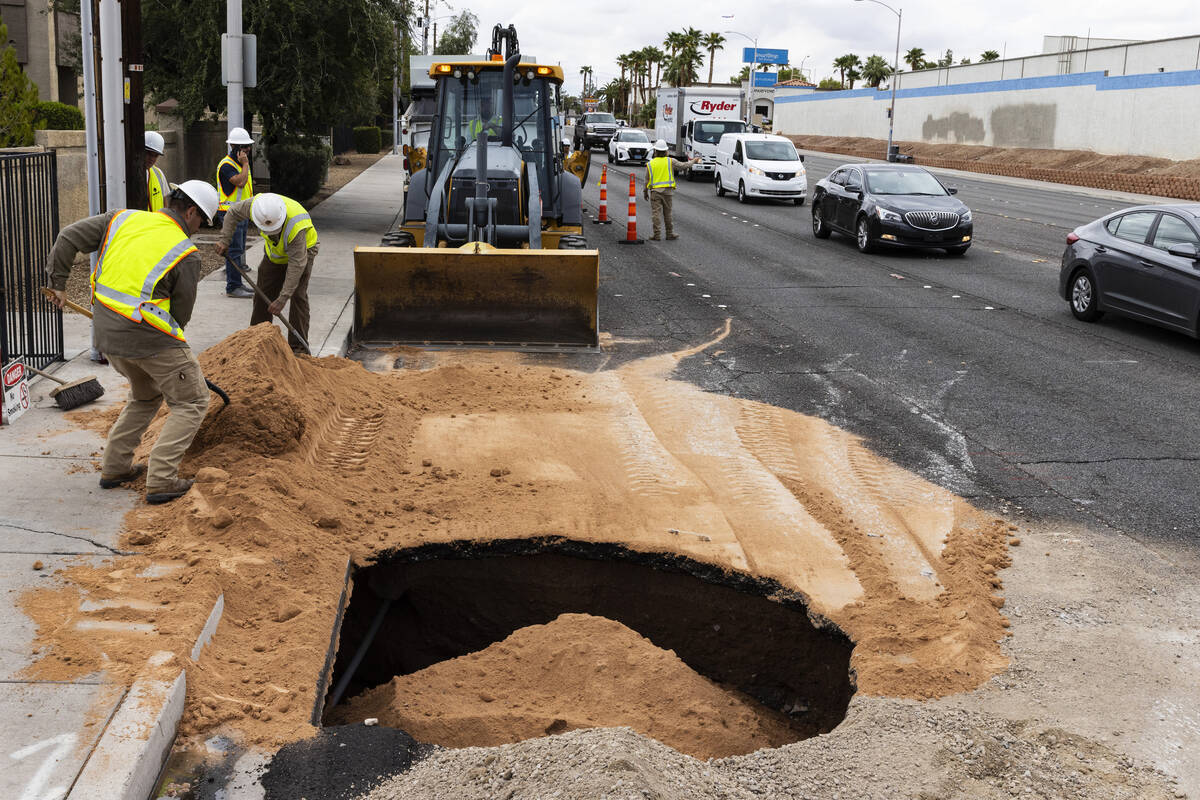 Traffic is backed up as crews continue to repair a large sinkhole near Jones Boulevard and Roch ...