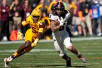 FILE - Oregon State running back Damien Martinez (6) runs past Arizona State defensive back Chr ...