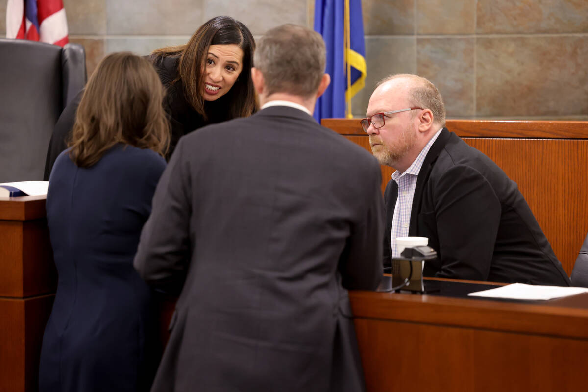 Clark County District Court Judge Danielle Chio meets with, from left, Jackie Nichols, an attor ...