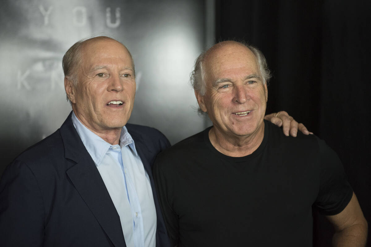 Frank Marshall and Jimmy Buffett arrive on the red carpet for the premiere of "Jason Bourne" at ...