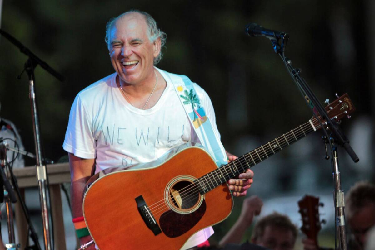Jimmy Buffett performs at his sister's restaurant in Gulf Shores, Ala., on June 30, 2010. (AP P ...