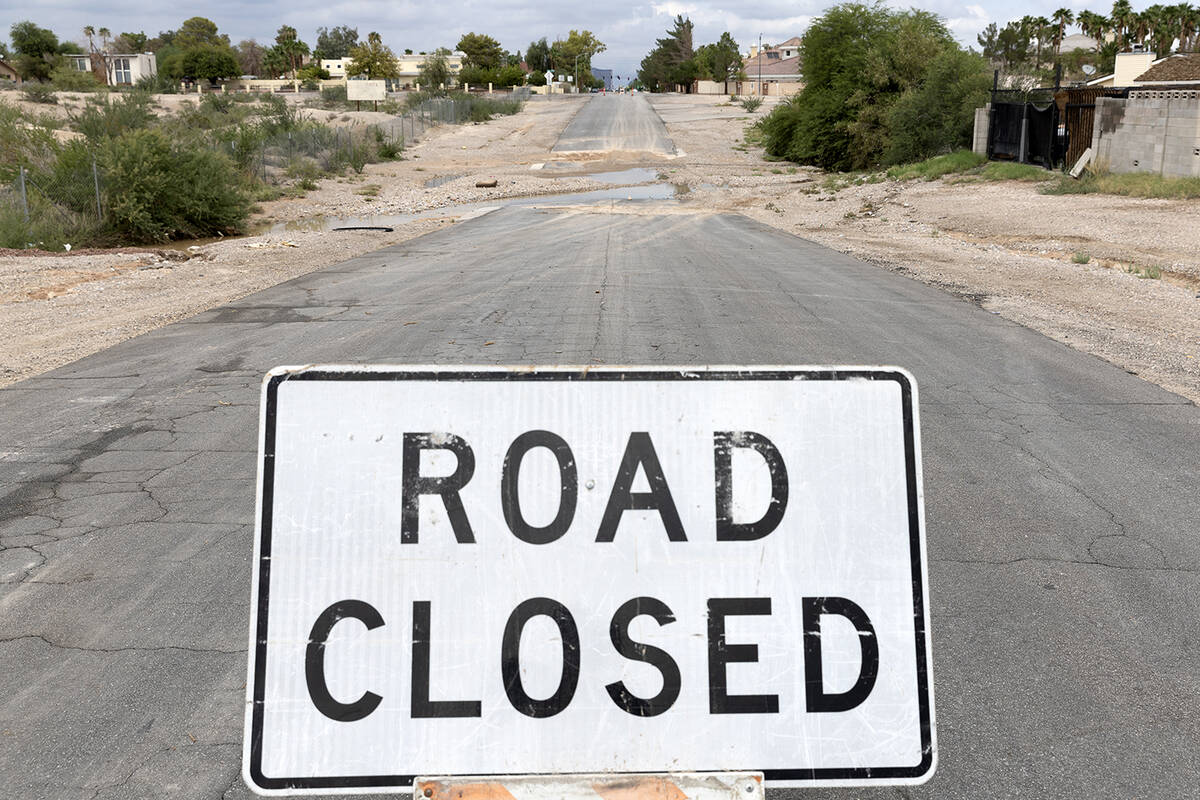 Gillespie Street at East Maulding Avenue is closed due to flash flood damage on Saturday, Sept. ...