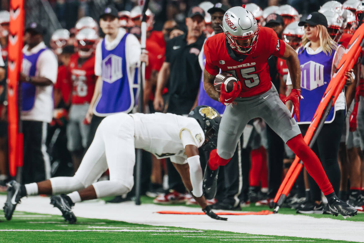 UNLV wide receiver Landon Rogers (15) tries to stay in bounds after catching the ball during a ...