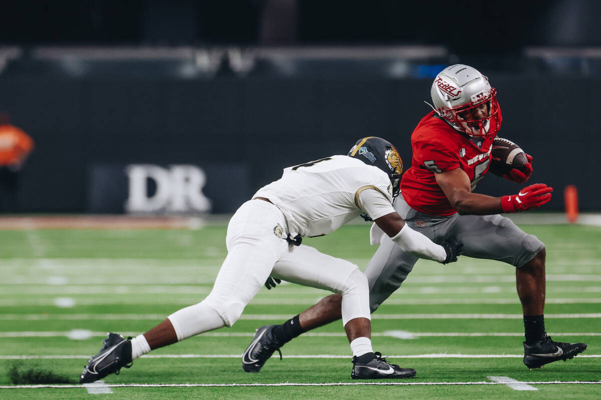 UNLV running back Vincent Davis Jr. (5) runs the ball down the field during a game against Brya ...