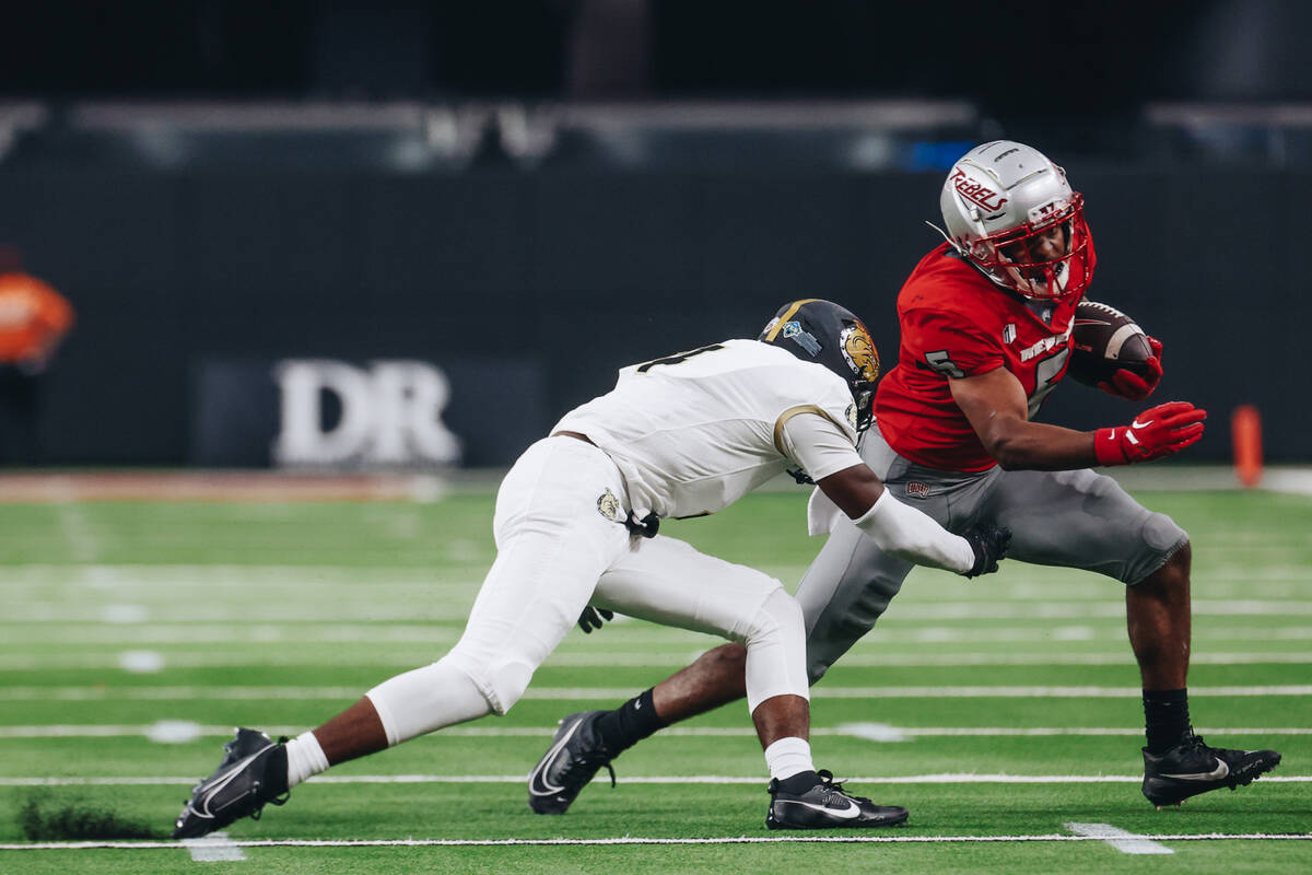 UNLV running back Vincent Davis Jr. (5) runs the ball down the field during a game against Brya ...