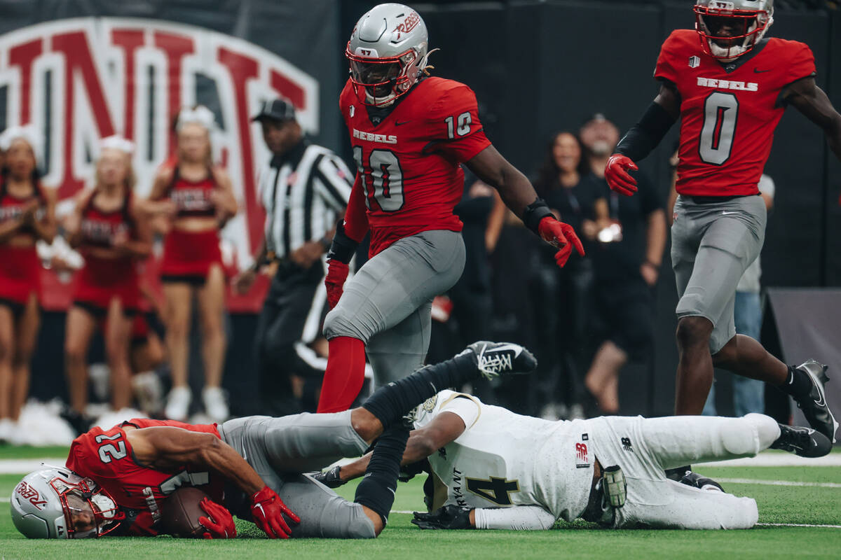 UNLV wide receiver Jacob De Jesus (21) falls short of reaching the end zone during a game again ...