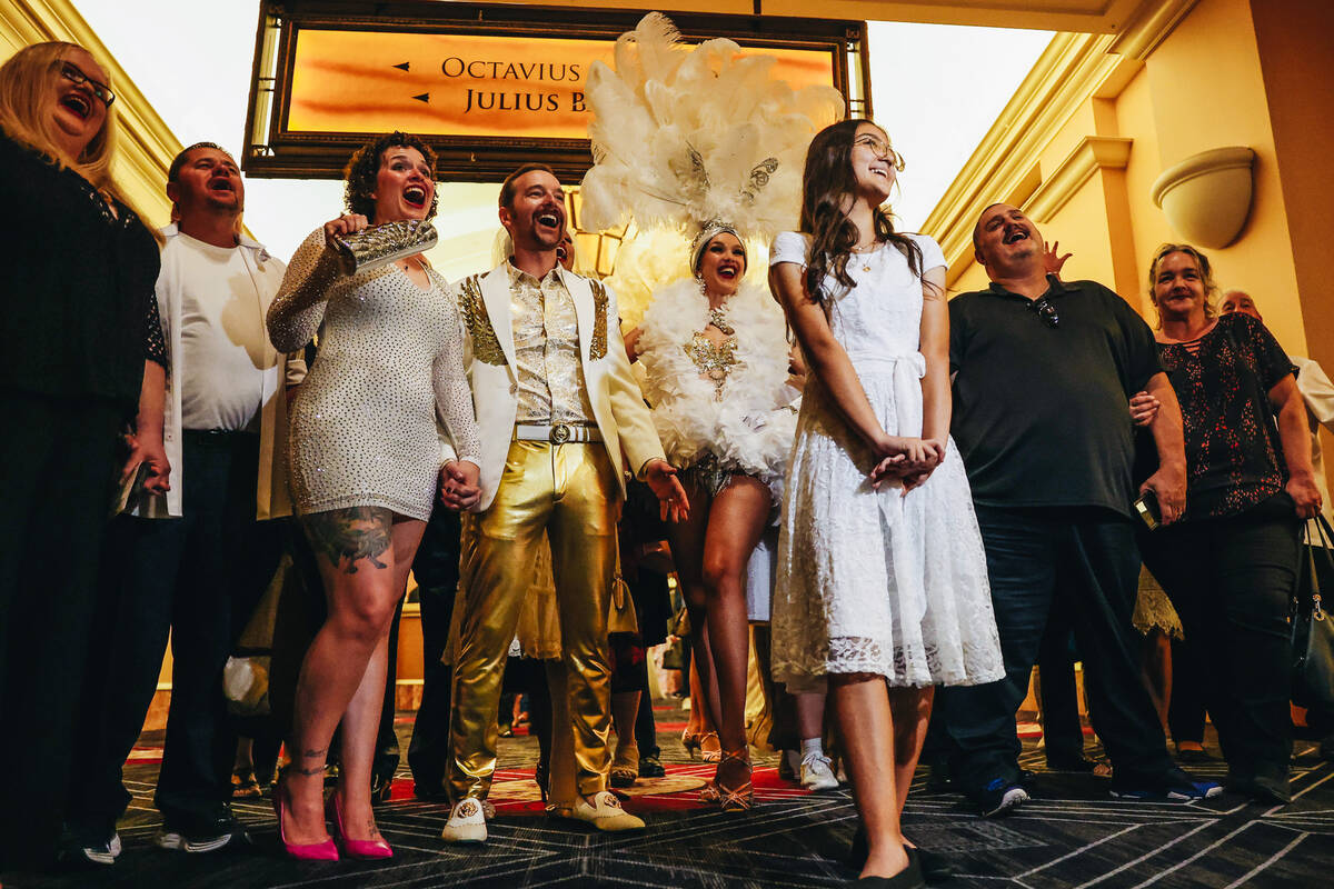 Couples get excited to renew their vows during a ceremony with 250 couples in total at Caesars ...
