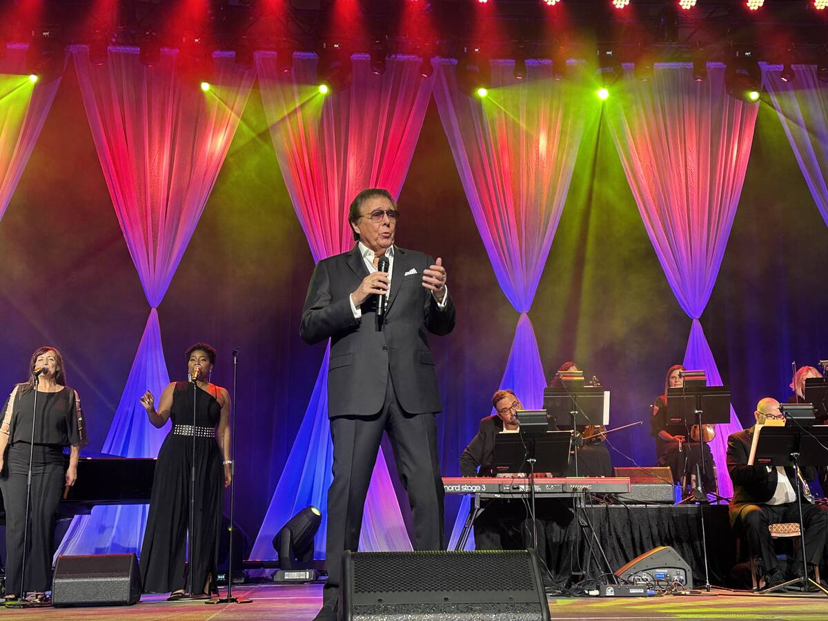 Dennis Bono performs during a wedding vow-renewal ceremony for nearly 300 couples as Las Vegas ...