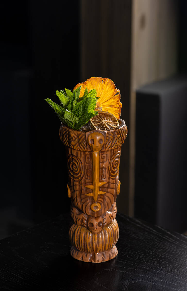 A keepsake tiki mug, filled with a Headhunter King cocktail, from Eureka restaurant in downtown ...