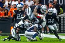 Denver Broncos wide receiver Jerry Jeudy (10) is taken down by Raiders cornerback Amik Robertso ...