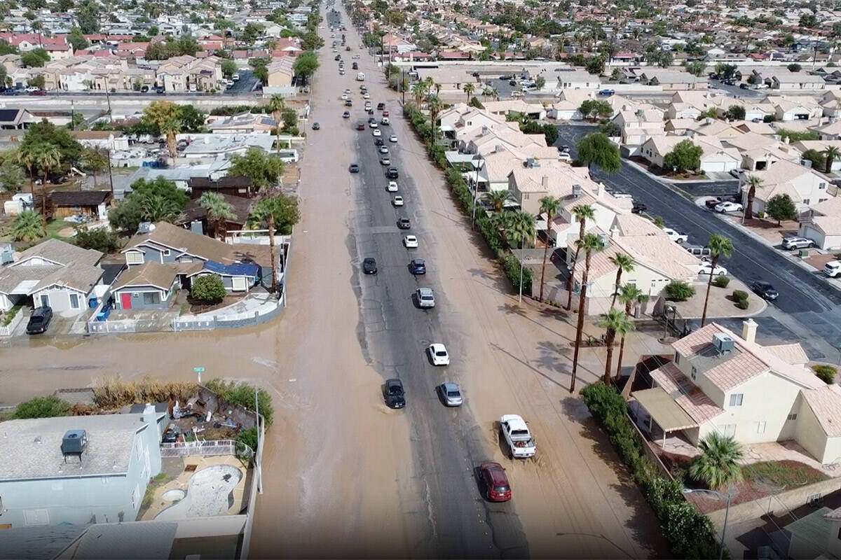 Roads flood on the East Side after monsoon storms dropped heavy rain across the Las Vegas Valle ...