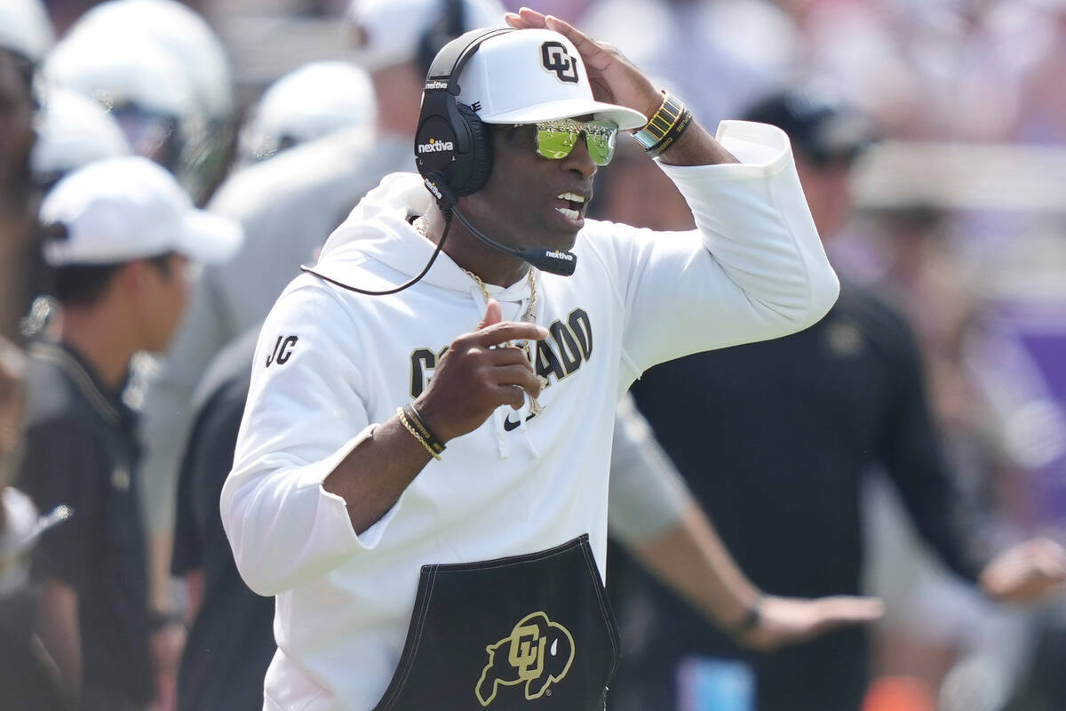 Colorado head coach Deion Sanders looks on from the sidelines during an NCAA college football g ...