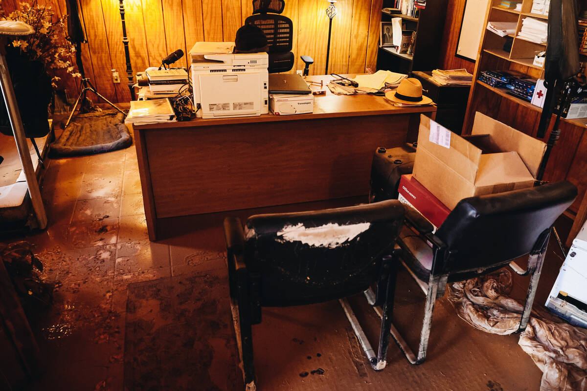 Chuck Muth’s home office is filled with mud and water after being impacted by recent flo ...