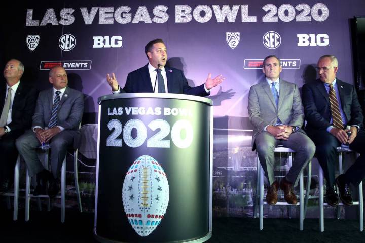 Pete Derzis of ESPN Events, from left, Steve Hill, CEO and president of the Las Vegas Conventio ...