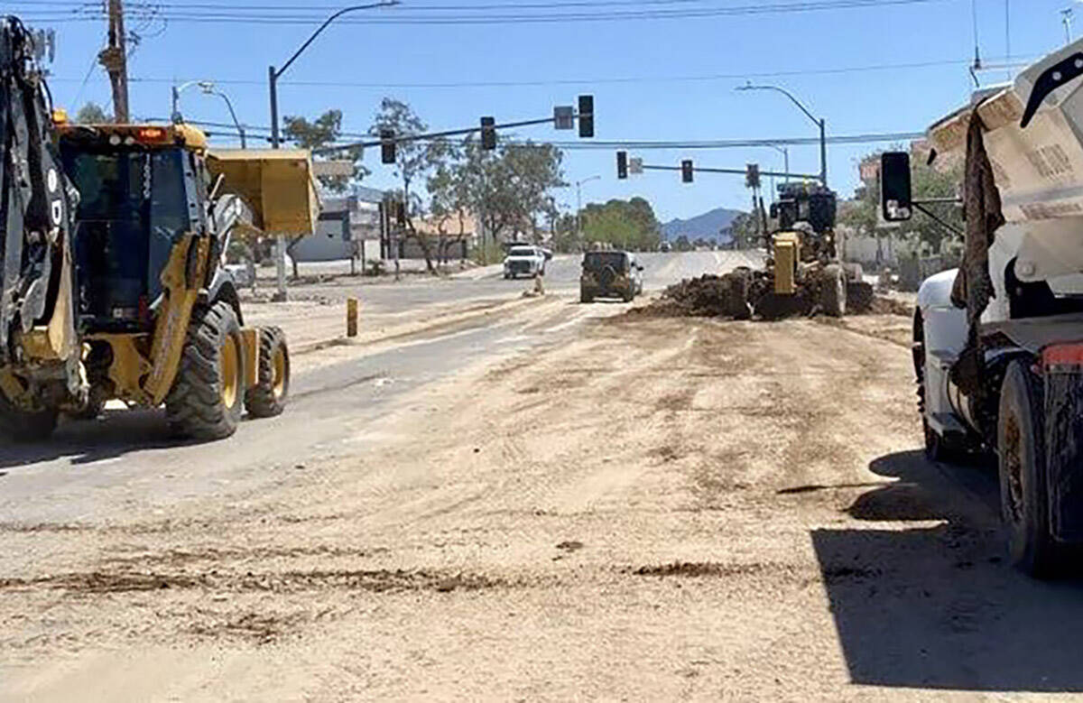 A back hoe, a dump truck and other repair vehicles work on an unspecified street on Monday, Sep ...
