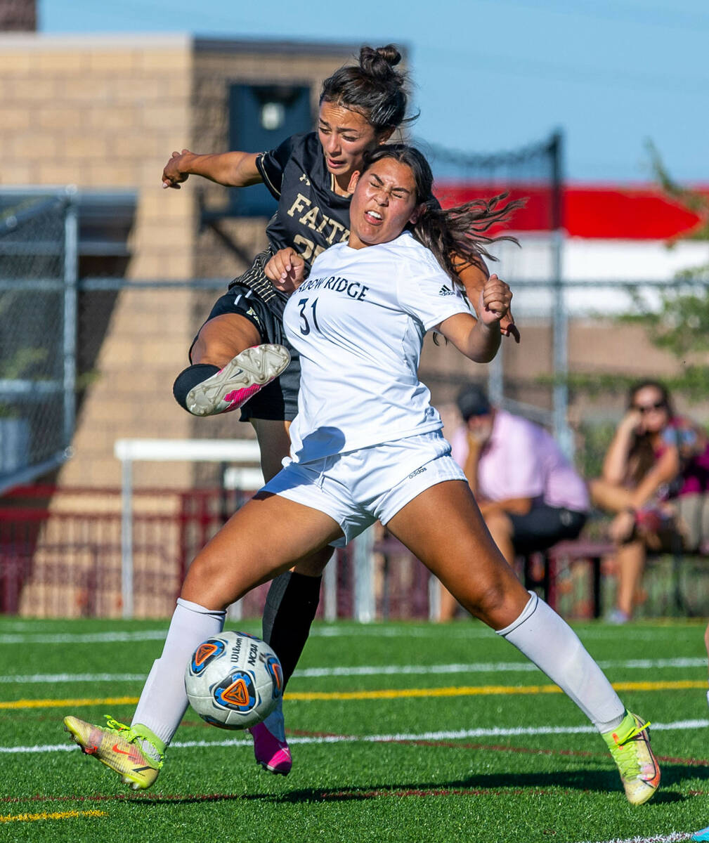 Faith Lutheran forward Riley Renteria (25) is driven off the ball by Shadow Ridge defender Kend ...