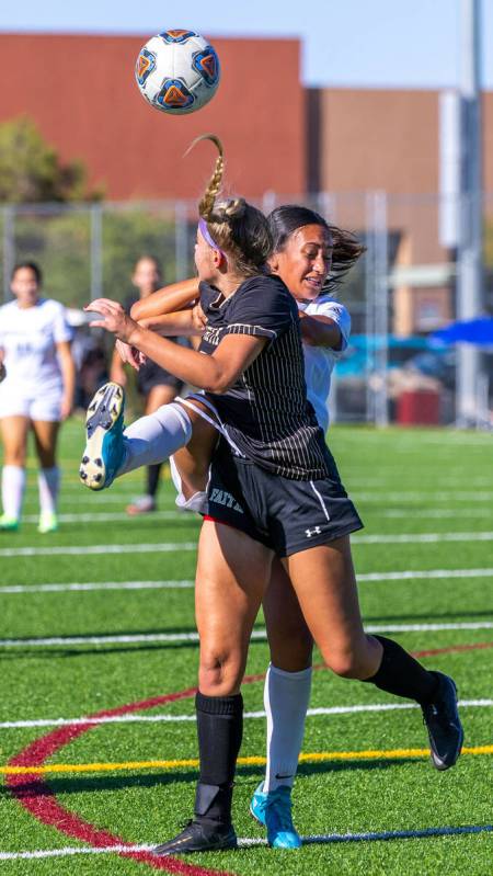 Shadow Ridge midfielder Carmen Loo (7) kicks the ball away from Faith Lutheran defender Jaycee ...