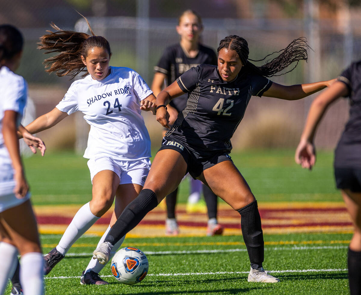 Shadow Ridge midfielder Leighanne Kim (24) battles for the ball with Faith Lutheran defender Ja ...