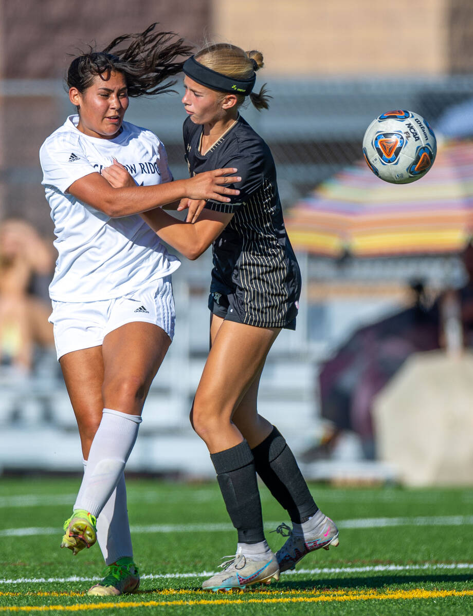 Shadow Ridge defender Kendall Houghton (31) sends the ball past Faith Lutheran midfielder Glori ...