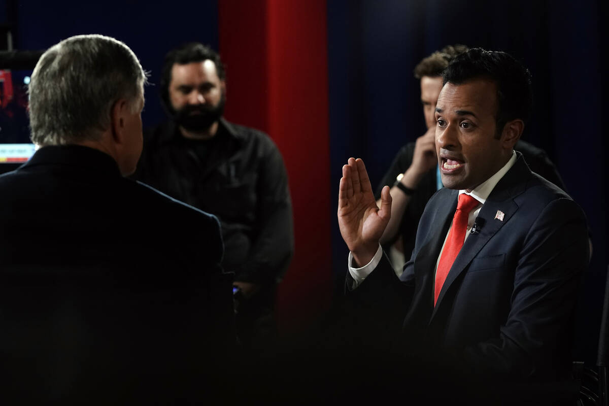 Businessman Vivek Ramaswamy talks with Sean Hannity in the spin room after a Republican preside ...