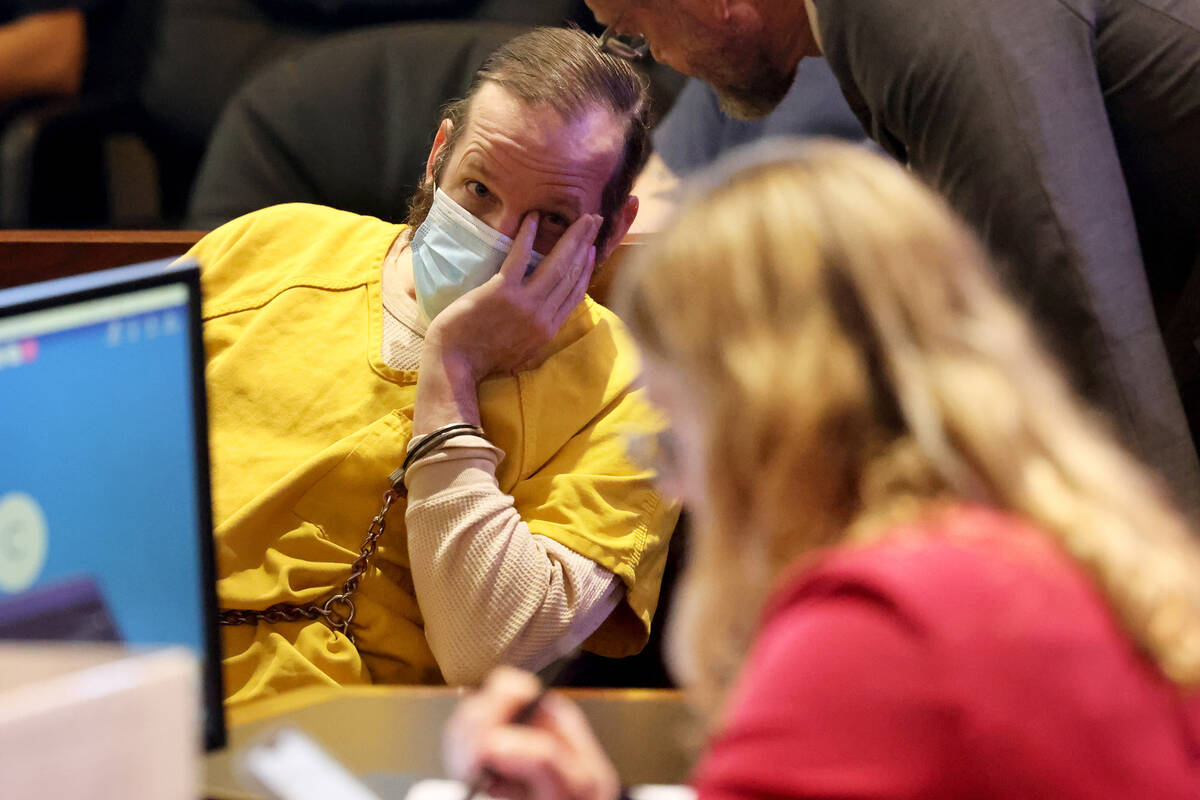 Stephen Thomas Parshall, an alleged member of the extremist boogaloo movement, hides his face f ...