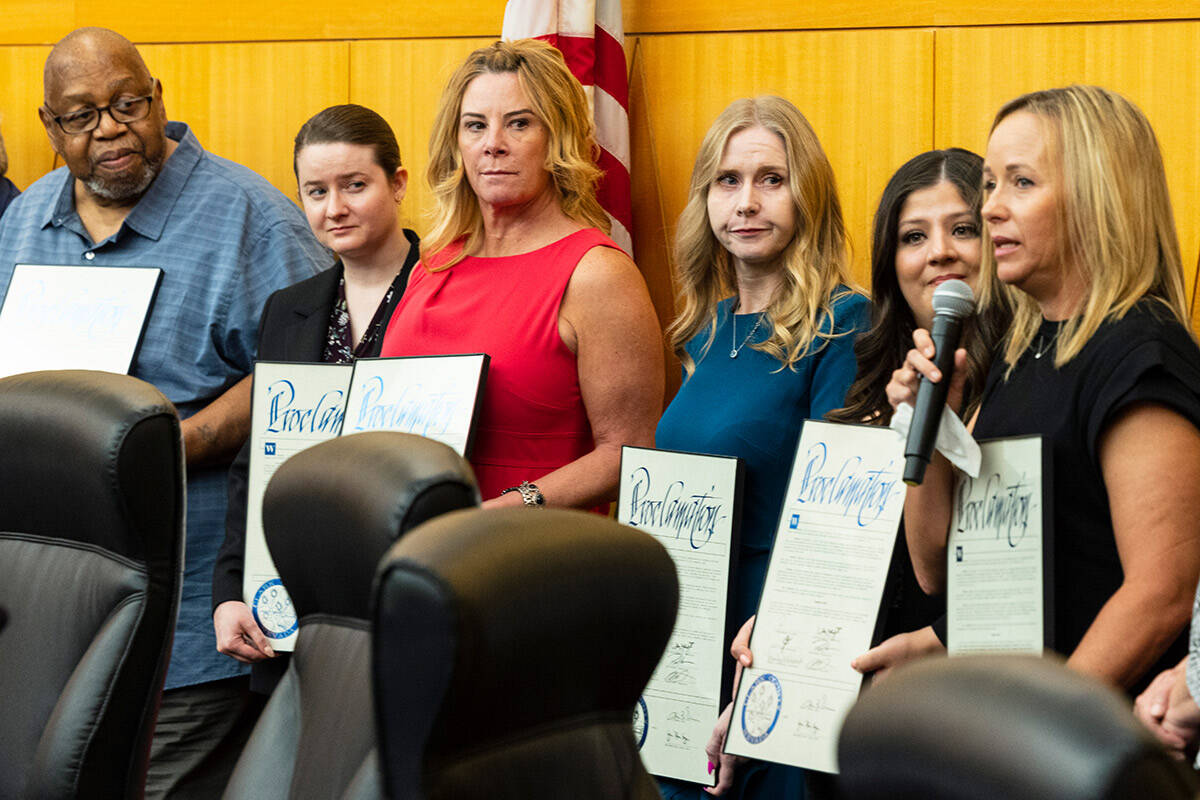 Mynda Smith, right, the 1 October Memorial committee member, speaks as Karessa Royce, second ri ...