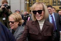 FILE — E. Jean Carroll, right, walks out of Manhattan federal court, May 9, 2023, in New ...