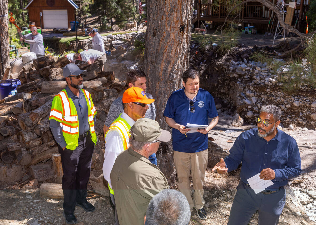 Congressman Steven Horsford, right, talks with residents and officials along Aspen Avenue in Ol ...