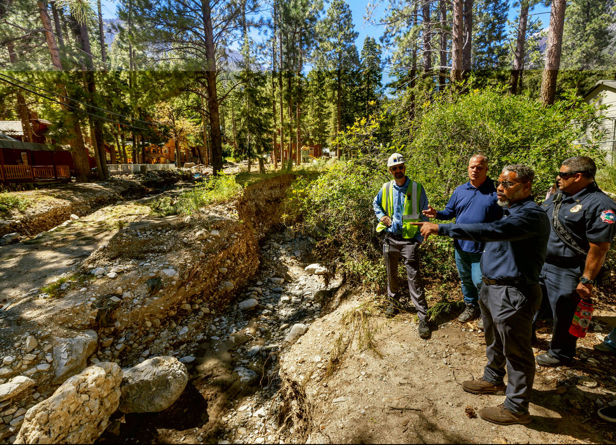 Congressman Steven Horsford, right, talks about electrical issues with officials along Aspen Av ...