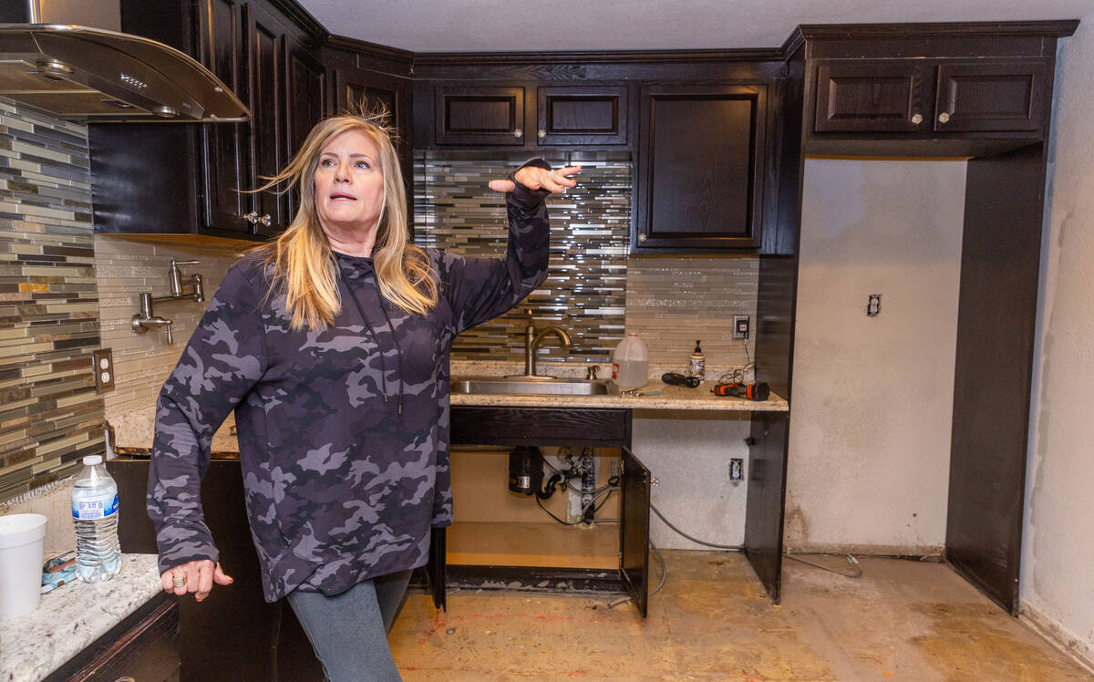 Old Town resident Tia Koester talks about the rushing waters running through her home on Mount ...