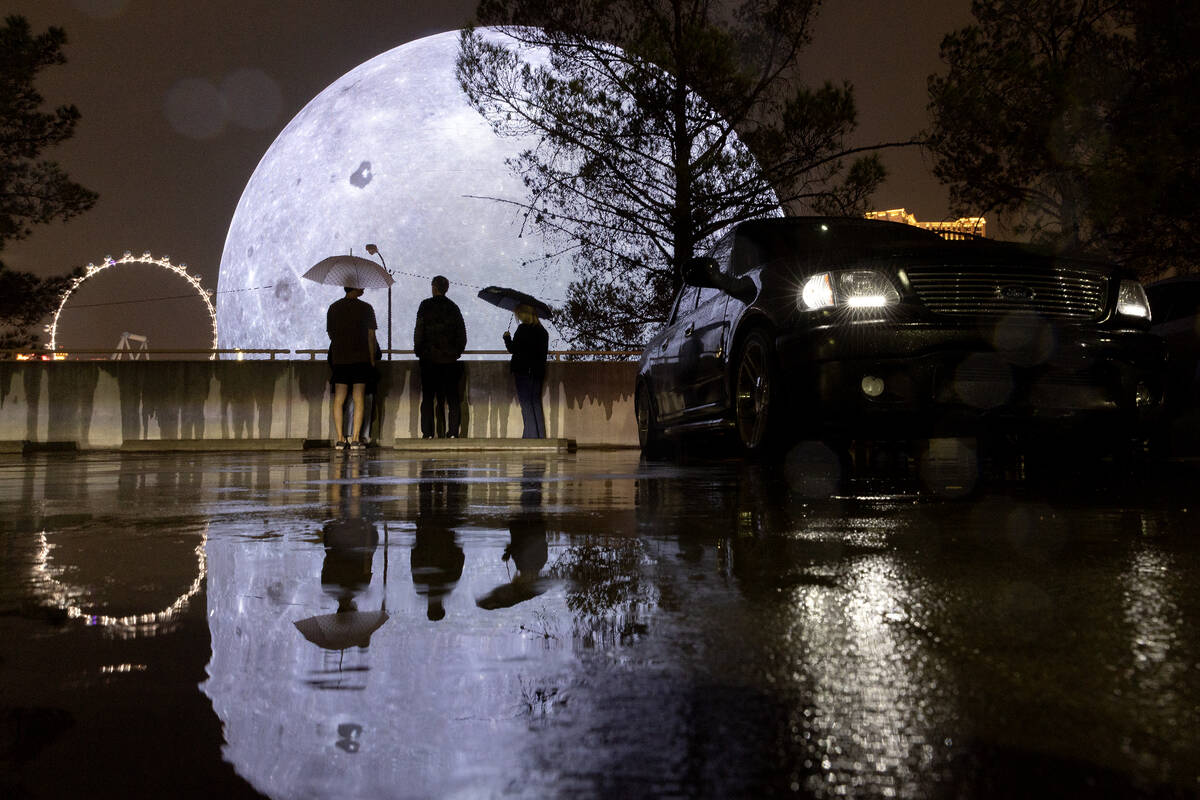 Despite rain, people visit the Sphere on Saturday, Aug. 19, 2023, in Las Vegas. Southern Nevada ...