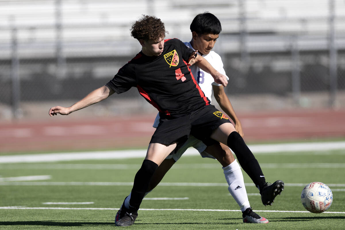 Las Vegas' Daniel Murillo (4) and Sunrise Mountain's Gael Luna-Cinto (8) compete for the ball d ...