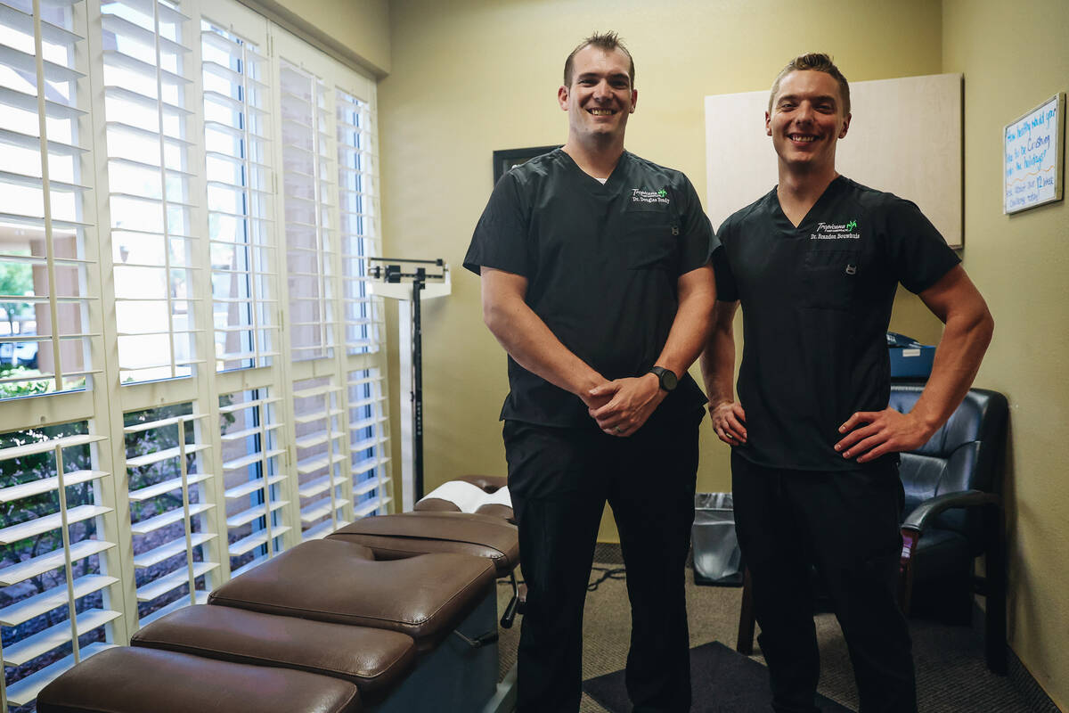Dr. Doug Brady, left, poses for a portrait with Dr. Brandon Bouwhuis at Tropicana West Chiropra ...