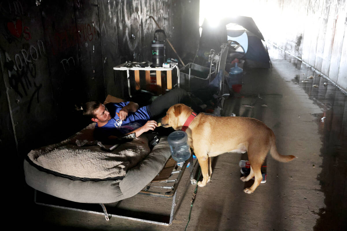 Paul, who declined to give his last name, and “Larry” camp in a flood control tun ...